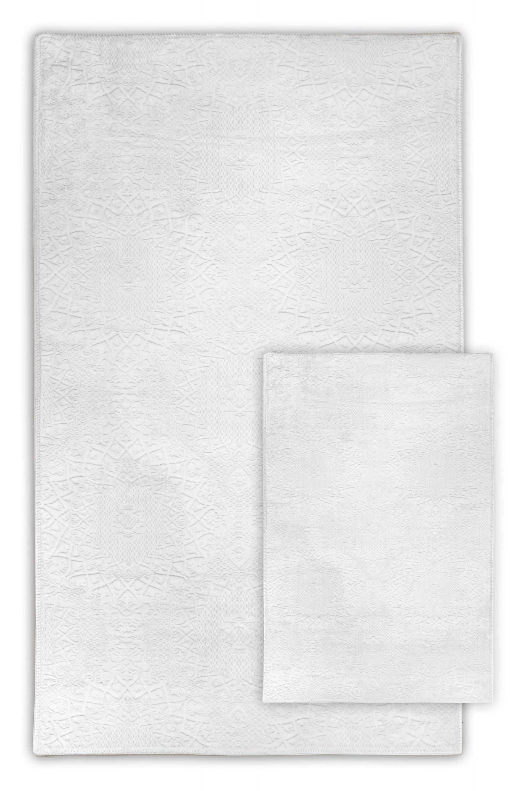 Weißer waschbarer Teppich mit filigranem Muster, ideal für moderne Wohnräume und Badezimmer