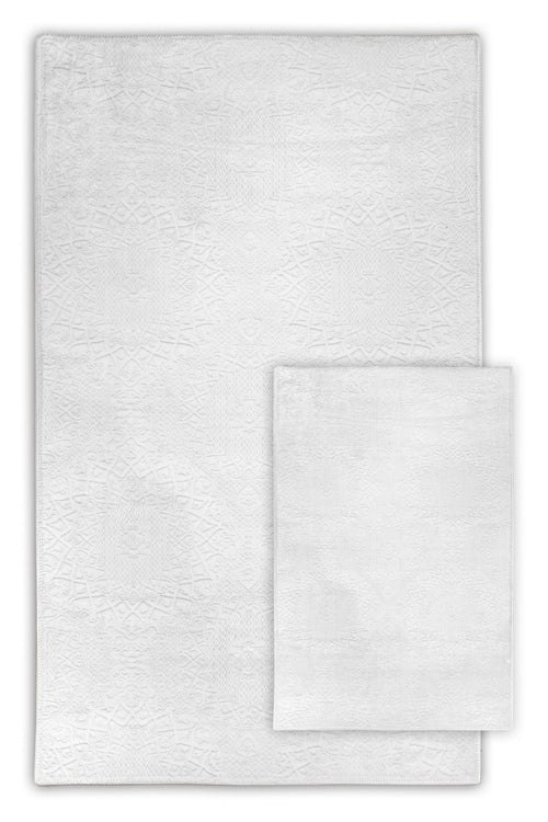Weißer waschbarer Teppich mit filigranem Muster, ideal für moderne Wohnräume und Badezimmer
