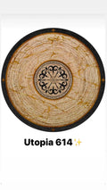 Round bamboo rug with beige and gold marbled pattern, black decorative border, and ornate central design.