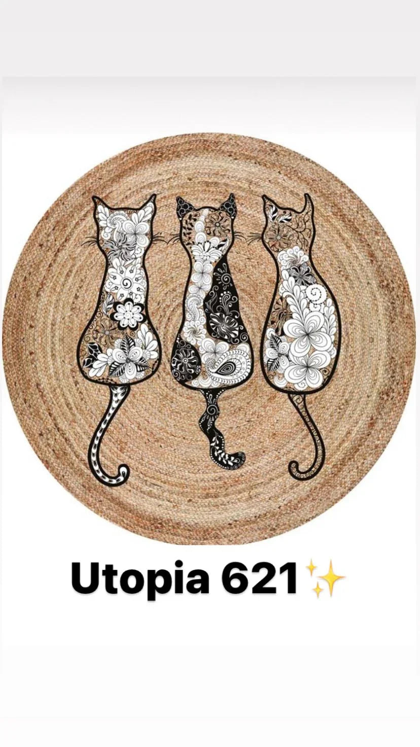 Round jute rug with three decorative black and white cats and floral patterns