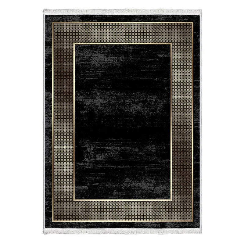 Black rectangular area rug with gold geometric border and modern distressed look