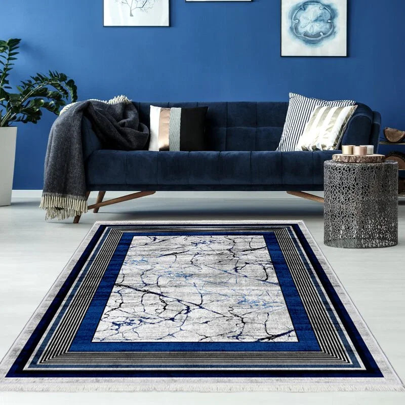 Modern blue and gray area rug with marble pattern in stylish living room