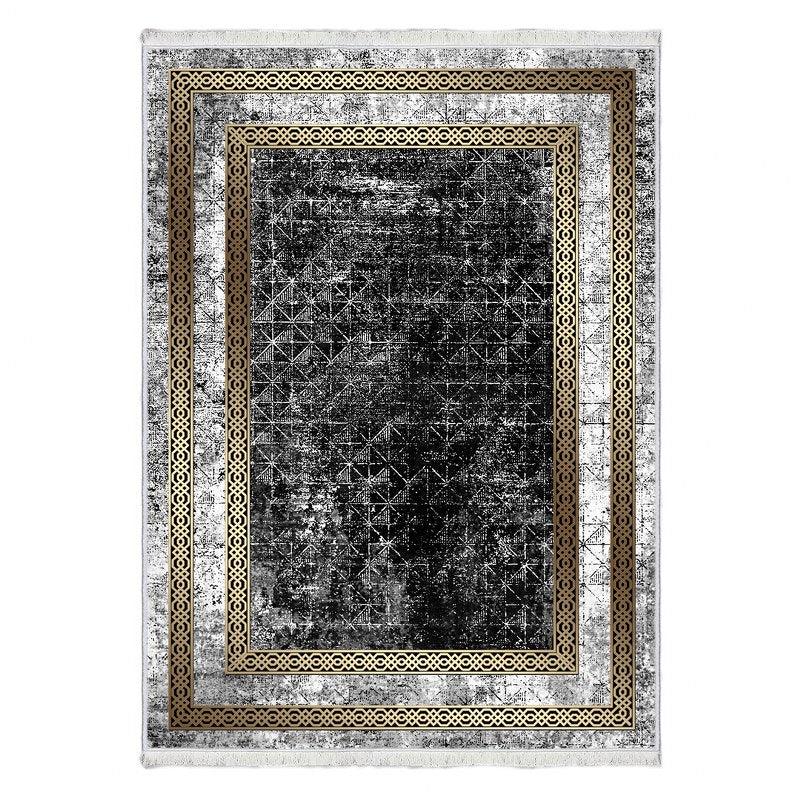 Black and gold geometric patterned washable area rug with decorative border