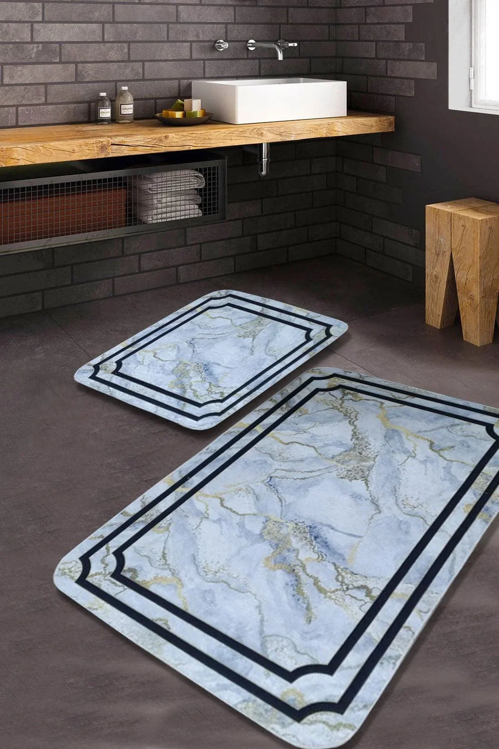 Two rectangular marble-look washable rugs with blue and gold veins in a modern bathroom.