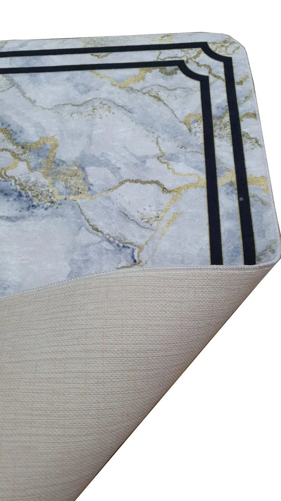 Washable rug with marble pattern and gold accents, black double border, flexible corner lifted