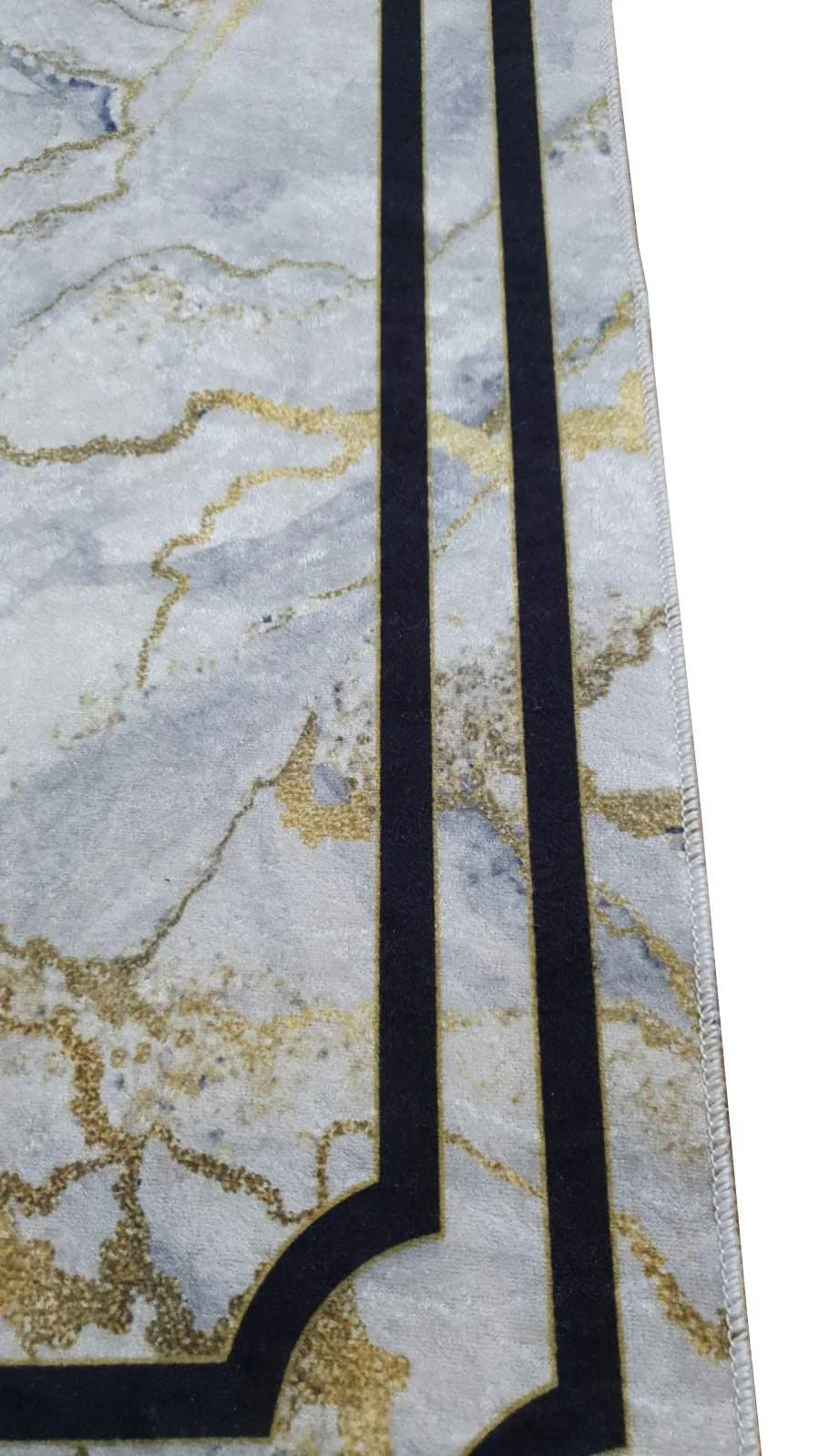 Modern washable rug with marble pattern and black geometric border, gold accents