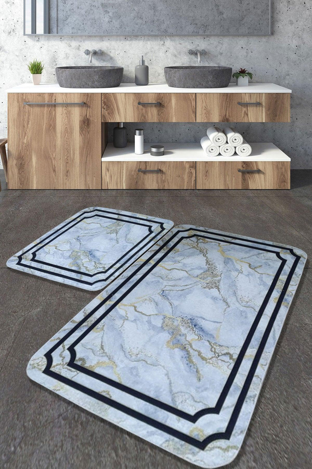 Set of two marble-patterned washable bathroom rugs on grey floor in modern bathroom