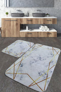 Modern washable rug set with marble pattern and gold geometric lines in a bathroom